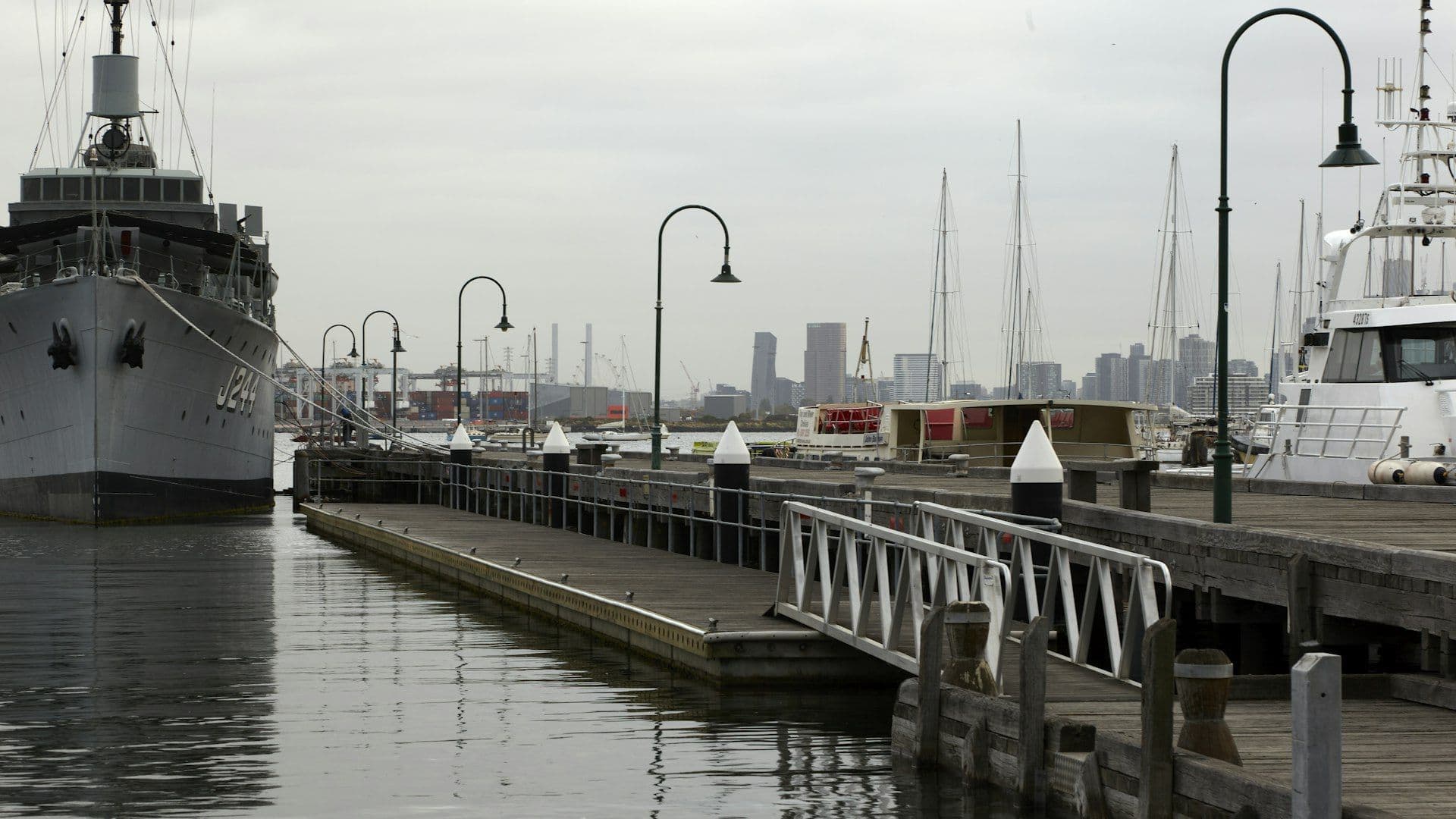 Williamstown waterfront with boats and Melbourne city skyline